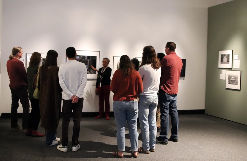 Harn docent giving a tour in the photography gallery