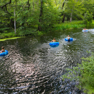 people floating on rafts down the spring fed river at itchetucknee springs state park