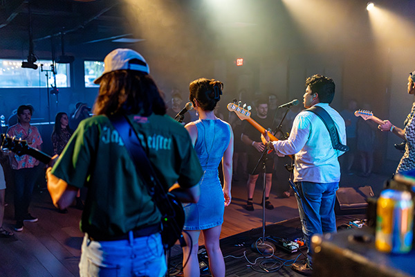 A band of three play for a crowd in Alachua County, Florida. 