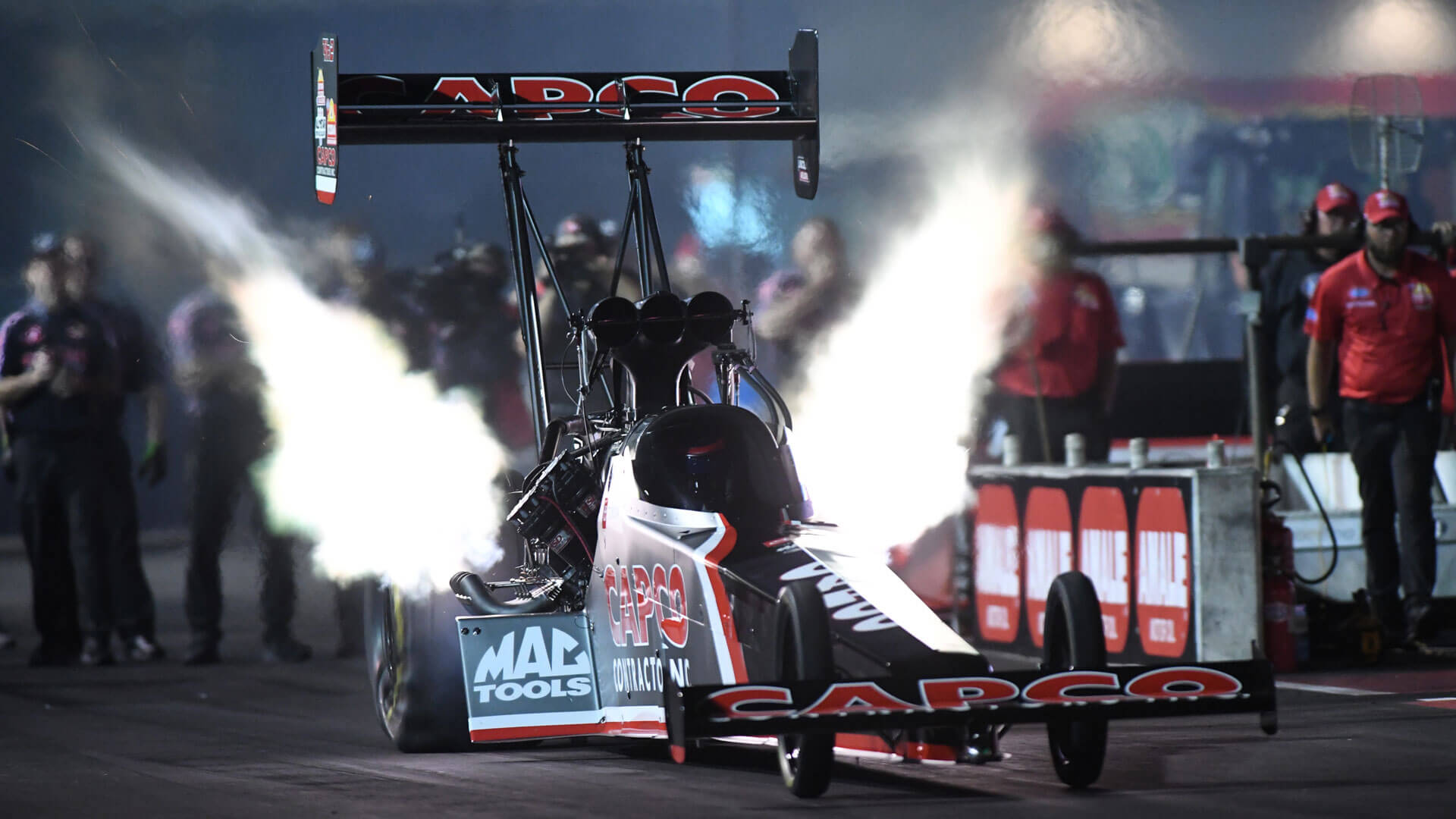 Gatornationals drag race car with flames.