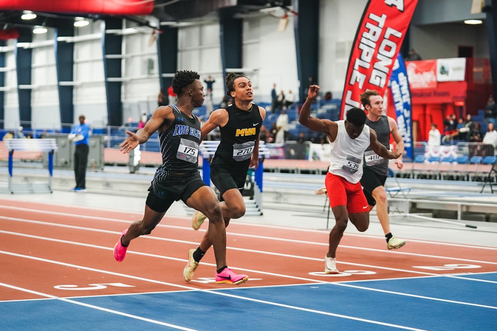 track and field athletes crossing the finish line