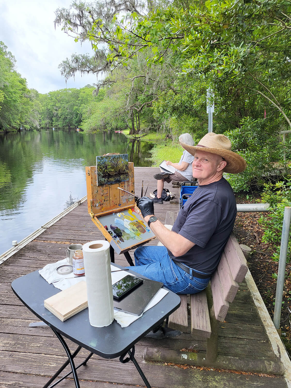 Artist Joe Ott painting next to the Santa Fe River