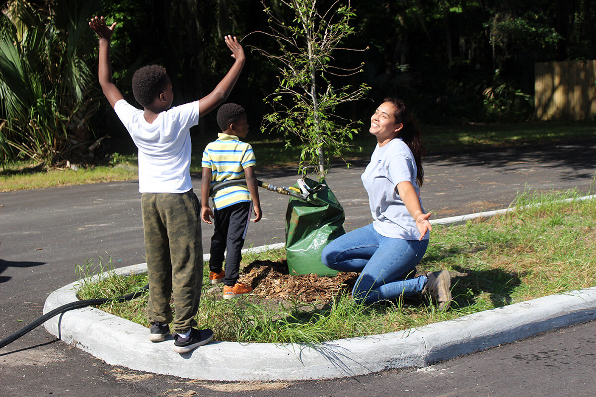 family planting a tree