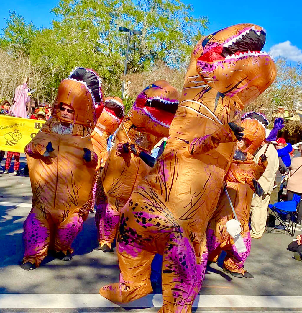 marching t-rex suits in the flying pig parade