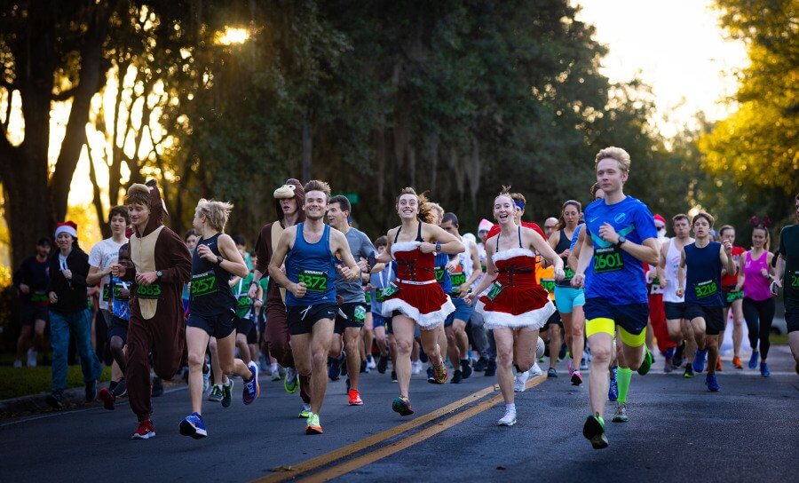 people in holiday costumes running in a holiday 5k